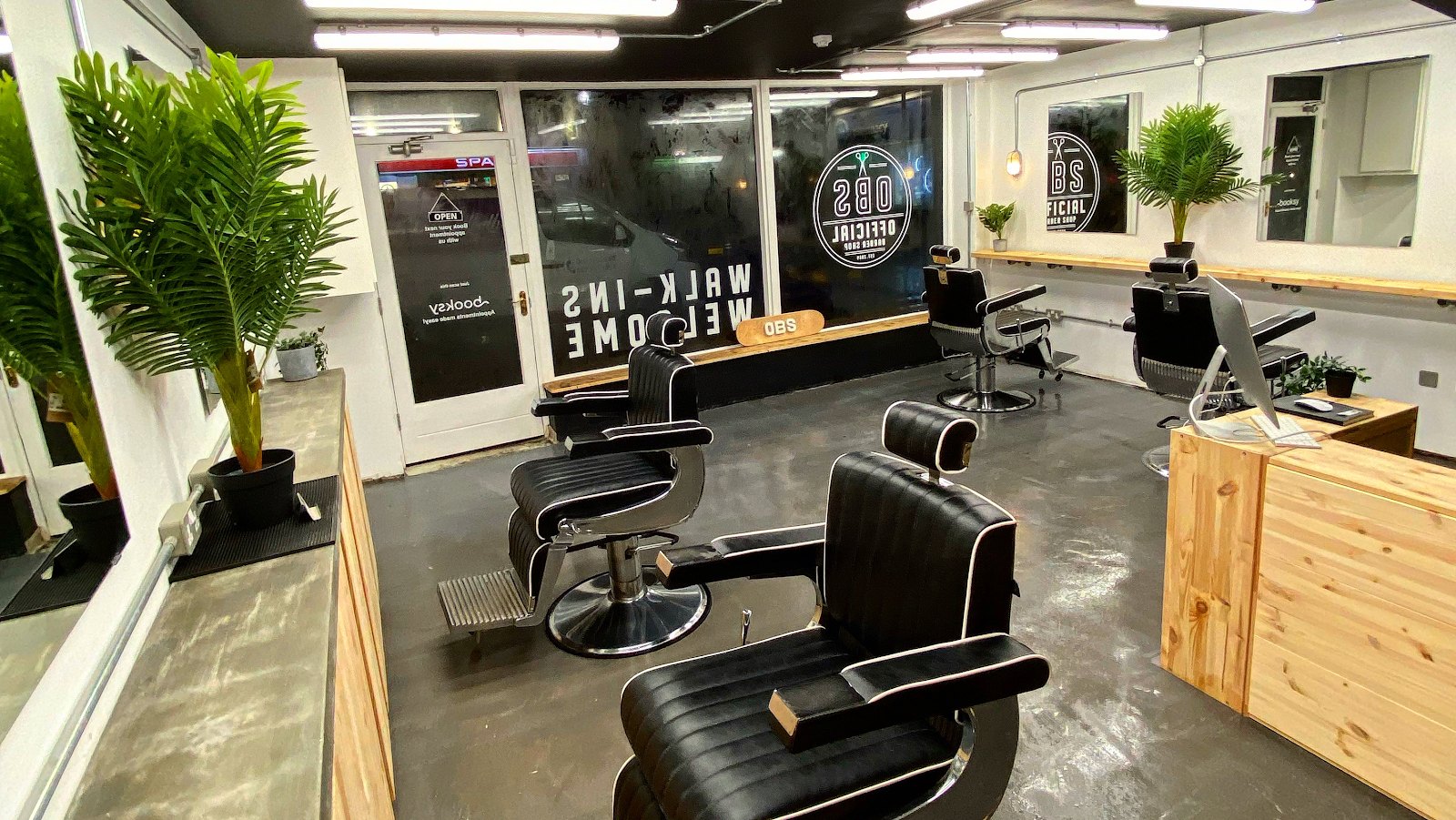 Official Barber Shop Killarney, looking toward the College Street windows with the OBS logo and Walk-ins Welcome